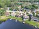 Aerial view showcasing lakefront homes, private docks, and lush greenery at 12520 Shadow Ridge Blvd, Hudson, FL 34669