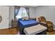 Bright bedroom with lake view and recliner at 12520 Shadow Ridge Blvd, Hudson, FL 34669