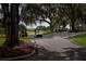 Golf cart path under shady oak trees at 1507 Belle Glade Ave, Sun City Center, FL 33573