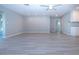 Bright and airy living room with new flooring and neutral walls at 1507 Belle Glade Ave, Sun City Center, FL 33573