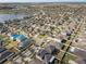 Aerial neighborhood view showing various homes, streets, and evidence of roof repairs at 15403 Fire Rock Pl, Ruskin, FL 33573