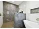 Modern bathroom with walk-in shower, bathtub and grey tile at 1565 13Th S St, St Petersburg, FL 33705