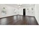 Open living space with dark hardwood floors and neutral walls at 1565 13Th S St, St Petersburg, FL 33705