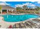 Large freeform swimming pool with plenty of lounge chairs at 16017 7Th E Ave, Bradenton, FL 34212