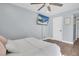 Bedroom with a queen bed, ceiling fan, and a large TV at 2060 Marilyn St # 241, Clearwater, FL 33765