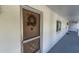 Building entrance with a brown door and screen door at 2060 Marilyn St # 241, Clearwater, FL 33765
