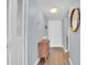Clean and bright entryway with wood floors and a mid-century modern console table at 2060 Marilyn St # 241, Clearwater, FL 33765