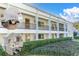 Inviting condo building with well-maintained landscaping and exterior balconies at 2060 Marilyn St # 241, Clearwater, FL 33765