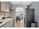 Modern kitchen with a view of the dining area and living room at 2060 Marilyn St # 241, Clearwater, FL 33765
