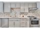 Modern kitchen with gray cabinets, quartz countertops, and stainless steel appliances at 2060 Marilyn St # 241, Clearwater, FL 33765