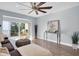 Bright living room featuring a glass door to the outside and modern furnishings at 2060 Marilyn St # 241, Clearwater, FL 33765