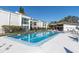 Community pool with lounge chairs and a covered patio at 2060 Marilyn St # 241, Clearwater, FL 33765