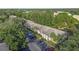 Aerial view of condo building and surrounding landscape at 3034 Eastland Blvd # D108, Clearwater, FL 33761