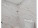 Shower stall with marble-look tile and a toilet at 3034 Eastland Blvd # D108, Clearwater, FL 33761