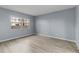 Spacious bedroom with gray walls and vinyl flooring at 3034 Eastland Blvd # D108, Clearwater, FL 33761