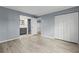 Bright bedroom with wood-look floors and an ensuite bathroom at 3034 Eastland Blvd # D108, Clearwater, FL 33761