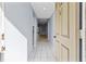 View down condo entry hallway, light-colored tile floors at 3034 Eastland Blvd # D108, Clearwater, FL 33761