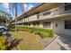 Condo building showcasing its architecture and landscaping at 3034 Eastland Blvd # D108, Clearwater, FL 33761