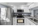 Modern kitchen with stainless steel appliances and granite countertops at 3034 Eastland Blvd # D108, Clearwater, FL 33761