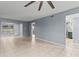 Bright living room with tile floors and access to other rooms at 3034 Eastland Blvd # D108, Clearwater, FL 33761