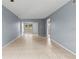 Large living room with tile floors and neutral-toned walls at 3034 Eastland Blvd # D108, Clearwater, FL 33761