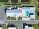 Aerial view of community pool, shuffleboard courts, and parking at 3101 Southport Dr, Holiday, FL 34690