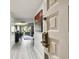 Bright entryway with light wood floors and view of living area at 36750 Us Highway 19 N # 01104, Palm Harbor, FL 34684