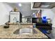 Kitchen sink and stovetop with granite countertop at 36750 Us Highway 19 N # 01104, Palm Harbor, FL 34684
