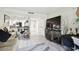 Living area with large TV and access to kitchen at 36750 Us Highway 19 N # 01104, Palm Harbor, FL 34684