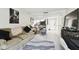 Open living space with sofa and view of kitchen area at 36750 Us Highway 19 N # 01104, Palm Harbor, FL 34684