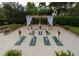 Outdoor yoga space with a pergola and lush landscaping at 36750 Us Highway 19 N # 01104, Palm Harbor, FL 34684