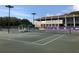 Well-maintained tennis courts with shaded seating areas at 36750 Us Highway 19 N # 01104, Palm Harbor, FL 34684