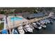 Community pool and tennis courts near marina, aerial view at 3954 Marine Pkwy, New Port Richey, FL 34652