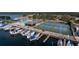 Aerial view of waterfront community with marina, pool, and tennis courts at 3954 Marine Pkwy, New Port Richey, FL 34652