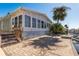 Exterior view of the home, showcasing a large sunroom and canal access at 3954 Marine Pkwy, New Port Richey, FL 34652