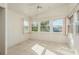 Sunroom with tiled floor and multiple windows at 3954 Marine Pkwy, New Port Richey, FL 34652