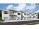 New townhome development with light blue exterior and attached garages at 4657 Pleasant Ave, Palm Harbor, FL 34683