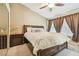 Spacious bedroom with a king-size bed, large closet, and neutral decor at 5167 6Th N Way, St Petersburg, FL 33703