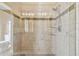 Large walk-in shower with glass enclosure and neutral tile at 5167 6Th N Way, St Petersburg, FL 33703