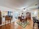 Dining room with hardwood floors and access to screened porch at 5213 Lantana St, Zephyrhills, FL 33542