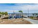 Mobile home features a covered carport and landscaped yard at 5312 Mary St, Zephyrhills, FL 33542