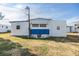 Single-wide manufactured home with blue accents and a grassy yard at 5312 Mary St, Zephyrhills, FL 33542