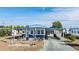 Mobile home with covered carport and American flag at 5312 Mary St, Zephyrhills, FL 33542