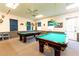 Spacious game room with two billiard tables at 5312 Mary St, Zephyrhills, FL 33542