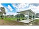 Relaxing covered pavilion area with benches near a lake at 5312 Mary St, Zephyrhills, FL 33542