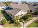 Exterior view of a yellow house with a porch and landscaping at 5314 Golden Isles Dr, Apollo Beach, FL 33572