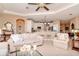 Open living room with a view of the kitchen and breakfast bar at 5314 Golden Isles Dr, Apollo Beach, FL 33572