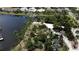 Stunning waterfront property with lush tropical landscaping and unique structures at 5314 Golden Isles Dr, Apollo Beach, FL 33572