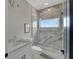 Modern bathroom featuring a glass shower with stone tile and a sleek vanity at 5713 Tybee Island Dr, Apollo Beach, FL 33572