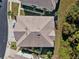 Aerial view of house showing roof and surrounding landscape at 8455 Shallow Creek Ct, New Port Richey, FL 34653